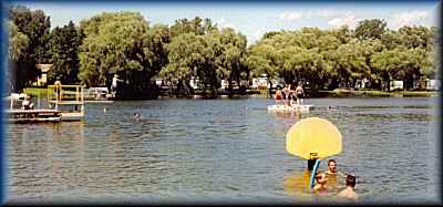  beach with diving board raft ~ Lake Lenwood Beach & Campground West Bend Wisconsin camping RV park